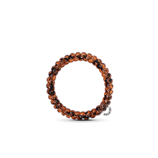 Spiral hair coil bracelet with tortoiseshell brown beaded design on white background
