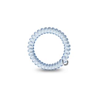 TELETIES spiral hair coil bracelet with silver charm on black background