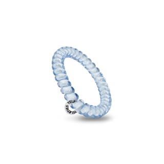 TELETIES spiral hair coil with branded charm on black background