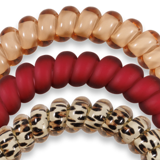 Three spiral hair coils in different patterns - solid translucent, solid red, and leopard print design.