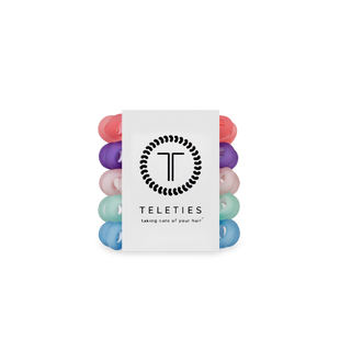TELETIES spiral hair coils in clear packaging showing colorful hair ties in various pastel and bright shades.