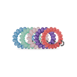 Five colorful spiral hair coils in blue, green, pink, purple, and coral arranged on white background