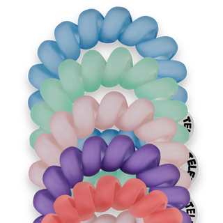 TELETIES spiral hair coils in multiple pastel colors displayed on black packaging card