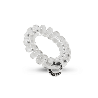 Clear spiral hair coil with TELETIES brand charm on white background