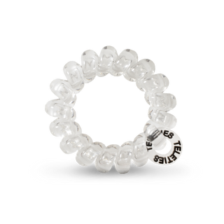 Clear spiral hair coils with scalloped edges and brand text on transparent background