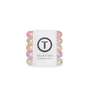 TELETIES spiral hair coils in shimmering pastel colors displayed in clear packaging with brand logo