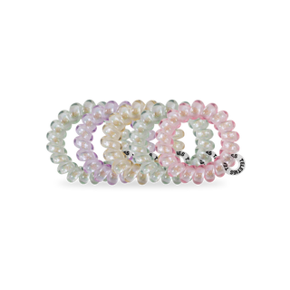 TELETIES spiral hair coils in shimmering pastel colors arranged on white background