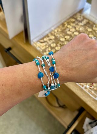 Ganz Starlight Stone Stretch Bracelet stacked on a wrist, featuring gemstone and silver beads.