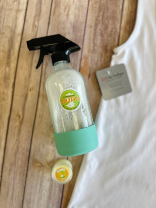 SUDS All Purpose Stain Remover spray bottle with trigger nozzle on wooden surface