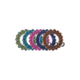 TELETIES Sweater Swatches Tiny Hair Ties set of five spiral coil hair ties stacked together.