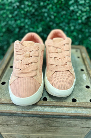 TOMS Rea Bloom sneakers with open weave texture and laces on wooden surface