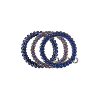 Set of four TELETIES small hair ties with beaded texture, stacked together on a dark background.
