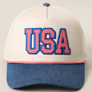 Fashion City trucker hat with red gingham USA embroidered patch, denim brim, and rope accent.