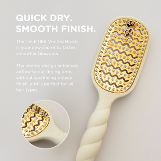 TELETIES vented hair brush with gold bristle pad and twisted handle for faster blowouts.