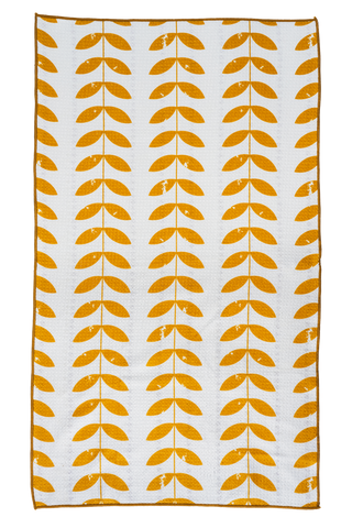 White kitchen towel with repeating orange leaf pattern in vertical rows