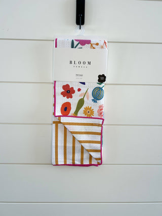 Bloom Towels wildflower kitchen towel with colorful floral pattern and striped design hanging on display hook