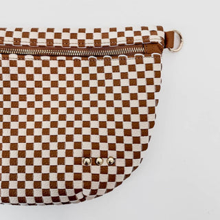 Brown and white checkered woven bum bag with zipper closure and metal studs